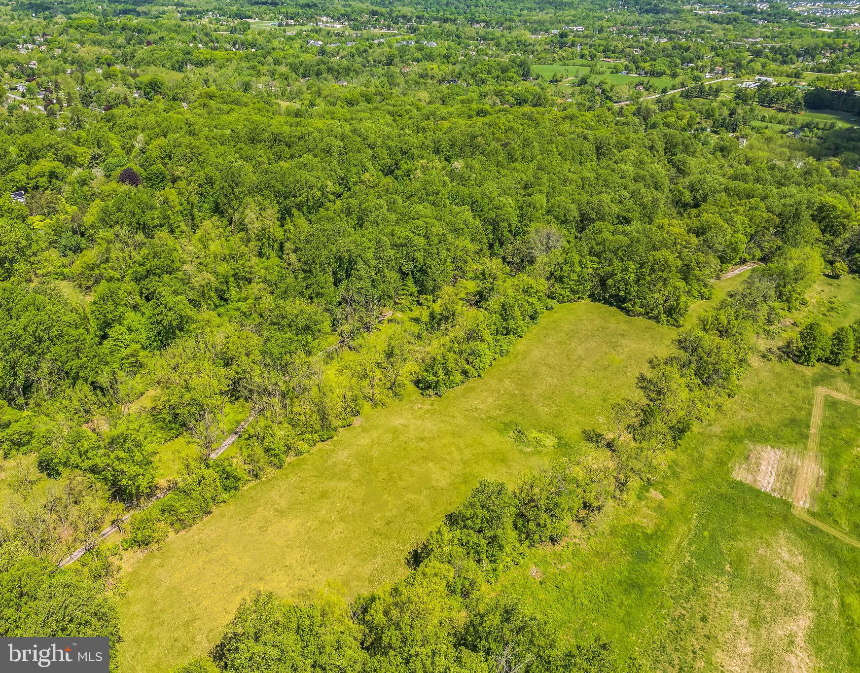 2585 Charlestown Road Phoenixville, PA 19460 - Photo 32 of 61 a view of a large yard with lots of trees