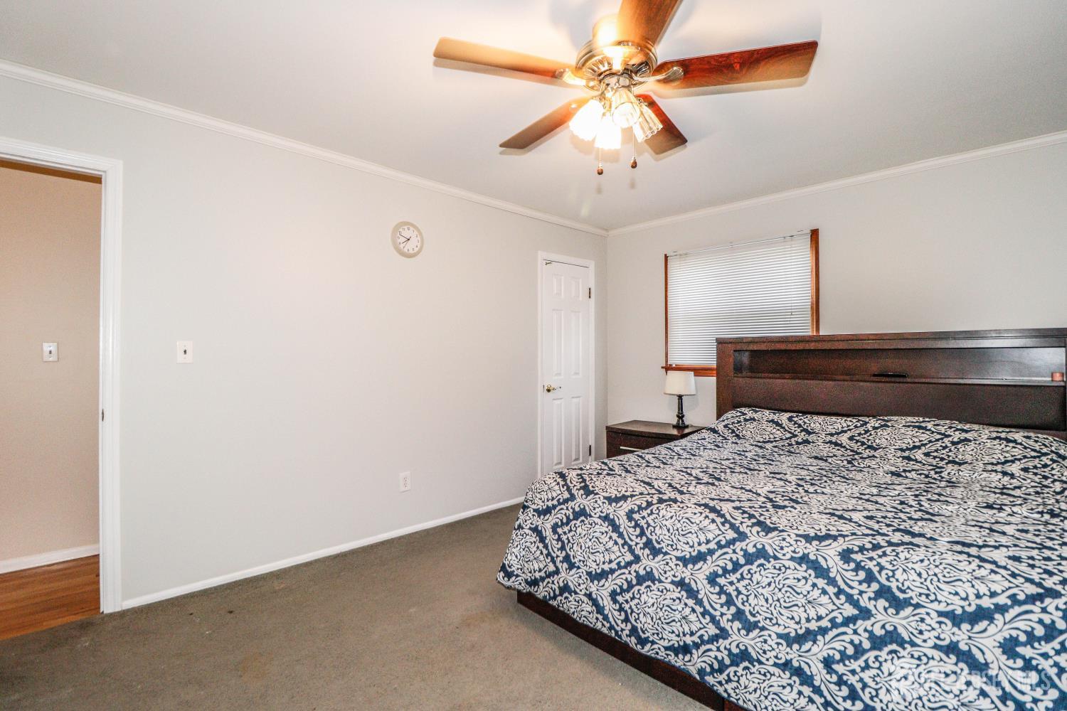 5 Timothy Court Edison, NJ 08837 - Photo 17 of 32 a bedroom with a bed and a chandelier