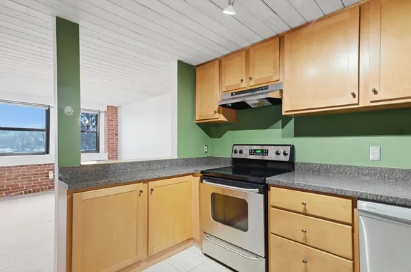 a view of a kitchen with washer and dryer