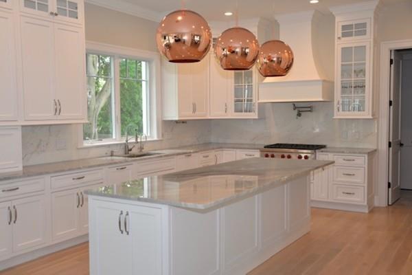 27 Littlefield Road Newton, MA 02459 - Photo 5 of 16 a kitchen with cabinets a window and a stove