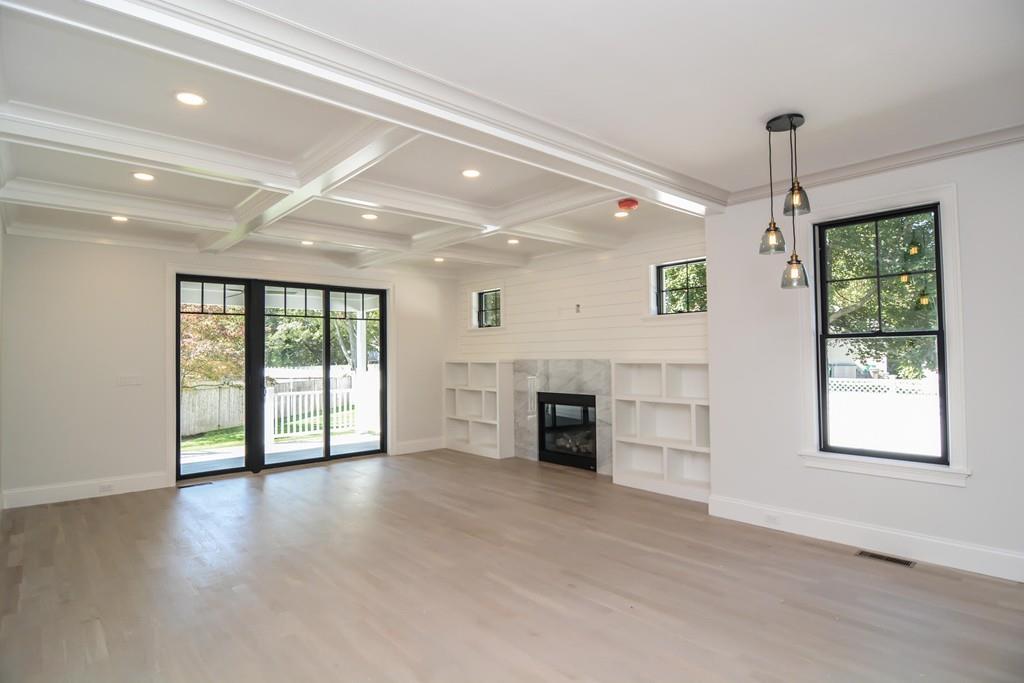 27 Littlefield Road Newton, MA 02459 - Photo 10 of 16 an empty room with windows and a ceiling fan
