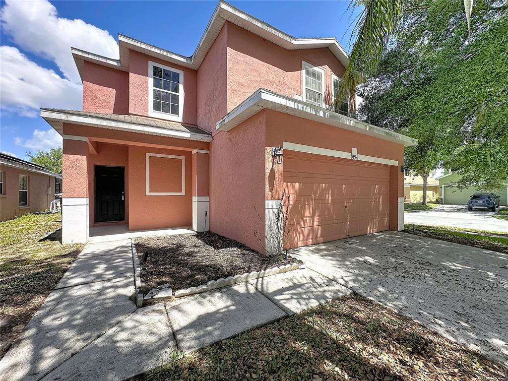 1893 Royal Ridge Drive Davenport, FL 33896 - Photo 1 of 38 a view of a house with a yard