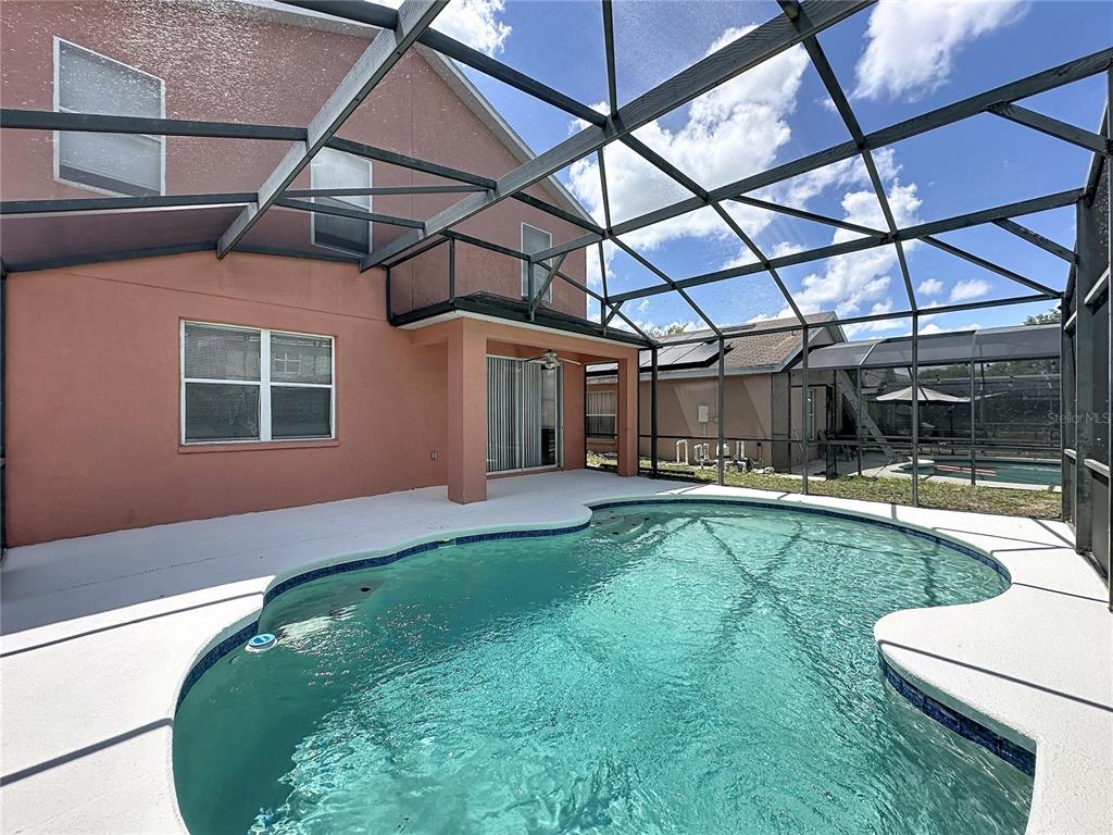 1893 Royal Ridge Drive Davenport, FL 33896 - Photo 19 of 38 a view of a backyard with swimming pool