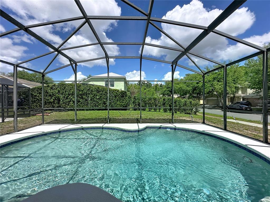 1893 Royal Ridge Drive Davenport, FL 33896 - Photo 20 of 38 a view of a backyard with a small deck and wooden fence