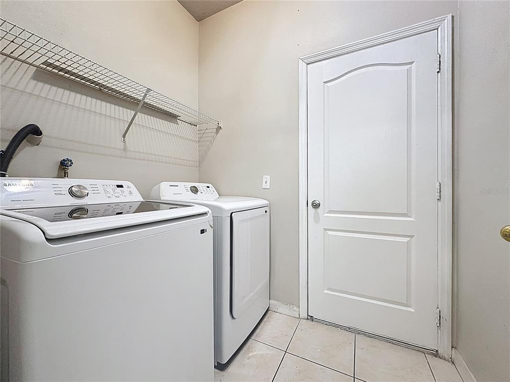 1893 Royal Ridge Drive Davenport, FL 33896 - Photo 21 of 38 a utility room with dryer and washer