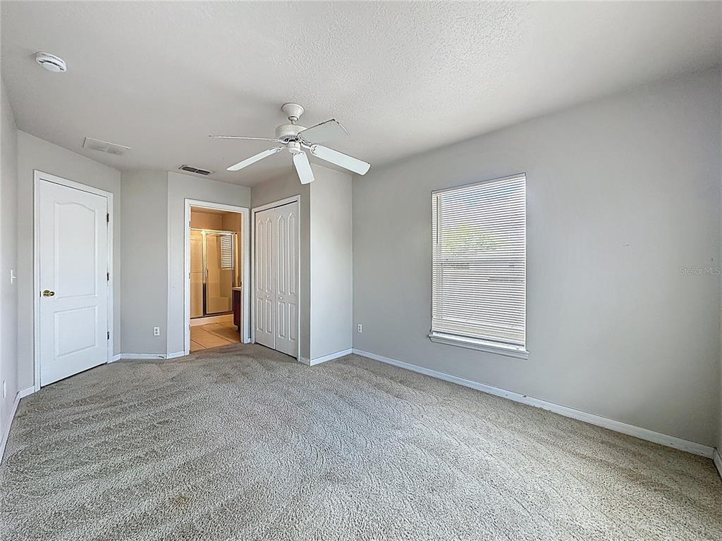 1893 Royal Ridge Drive Davenport, FL 33896 - Photo 24 of 38 an empty room with windows and closet