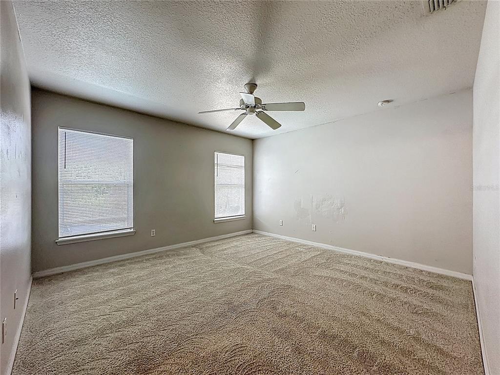 1893 Royal Ridge Drive Davenport, FL 33896 - Photo 27 of 38 a view of an empty room with a window