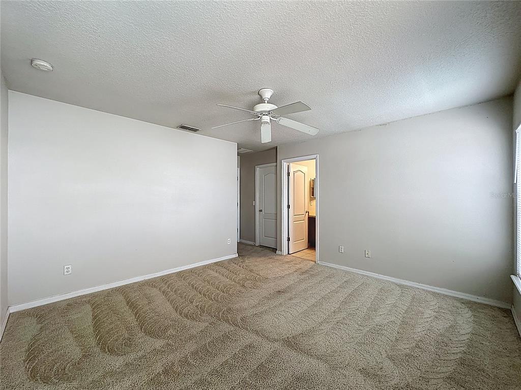 1893 Royal Ridge Drive Davenport, FL 33896 - Photo 29 of 38 a view of an empty room with a window