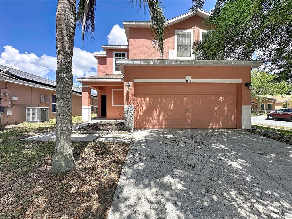 1893 Royal Ridge Drive Davenport, FL 33896 - Photo 3 of 38 a view of a house with a yard