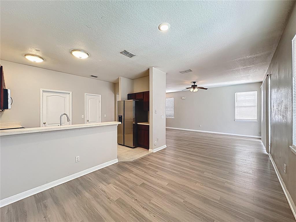 1893 Royal Ridge Drive Davenport, FL 33896 - Photo 10 of 38 a view of a kitchen with wooden floor and a kitchen