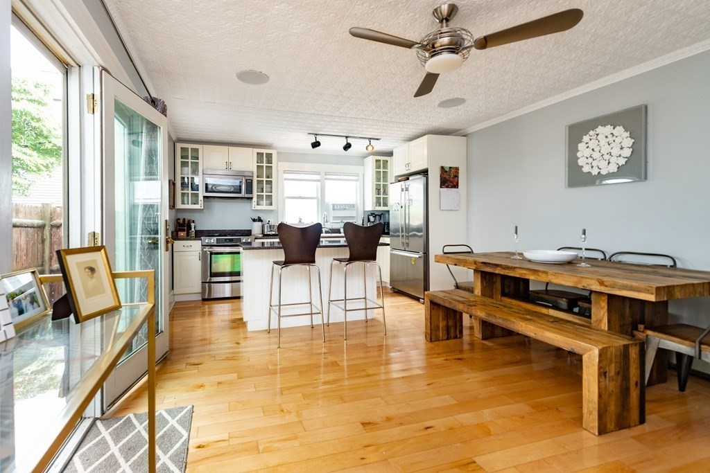 3 Crystal Place Boston, MA 02129 - Photo 1 of 1 a living room with stainless steel appliances kitchen island granite countertop furniture and a view of kitchen