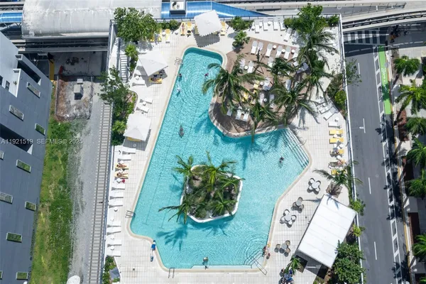 a view of a swimming pool with outdoor seating