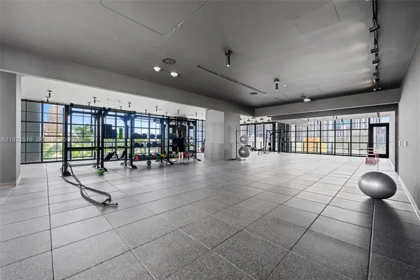 a living room with furniture potted plant and a potted plant