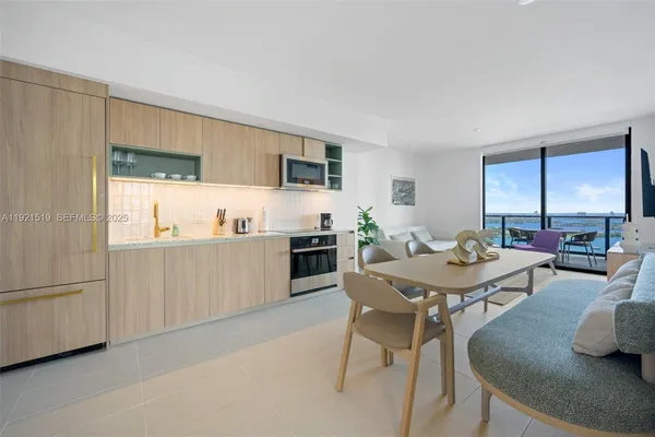 a view of a dining room with furniture and a livingroom