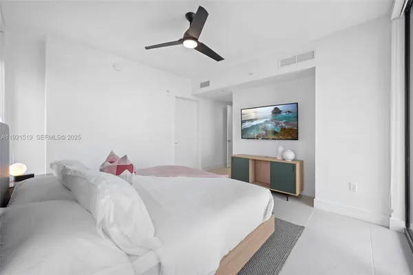 a spacious bathroom with a shower toilet sink and mirror