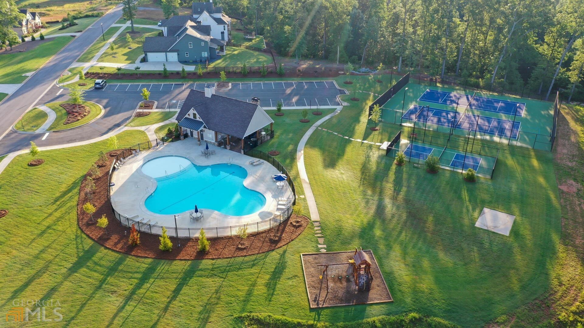 an aerial view of a house with outdoor space pool patio and outdoor seating