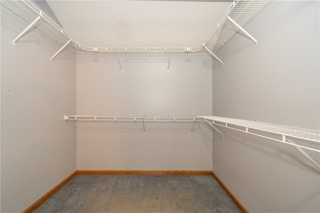 10584 New Biddinger Road Harrison, OH 45030 - Photo 35 of 61 This spacious walk-in closet offers ample storage and organization solutions.