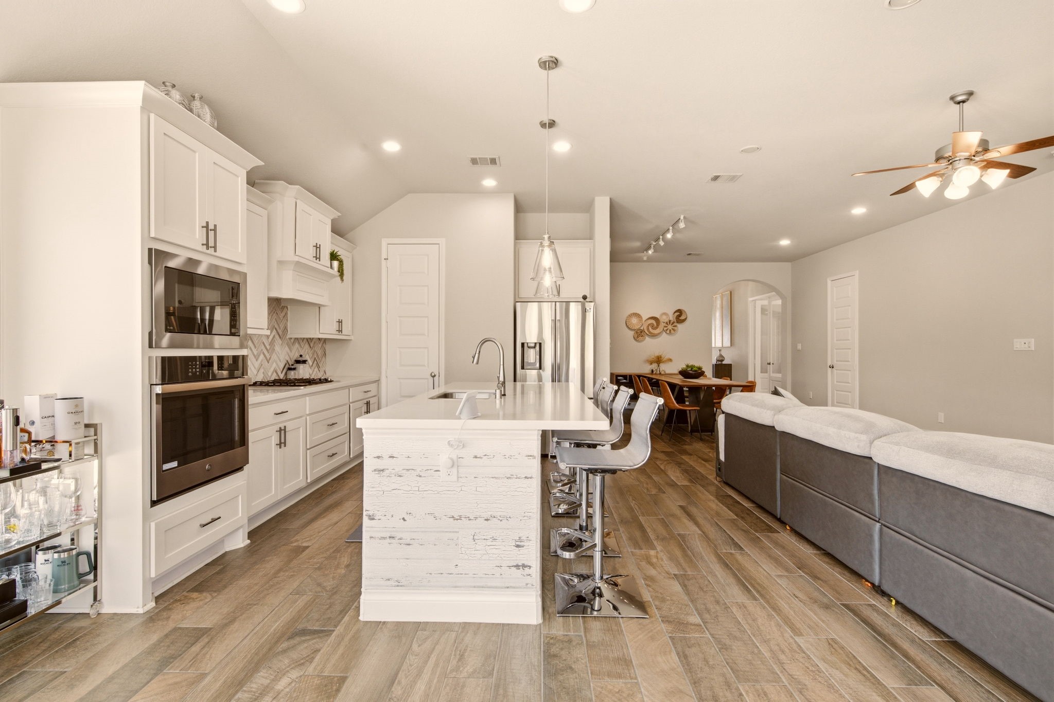 4359 Croft Creek Drive Spring, TX 77386 - Photo 15 of 46 a large white kitchen with lots of counter space wooden floor and appliances