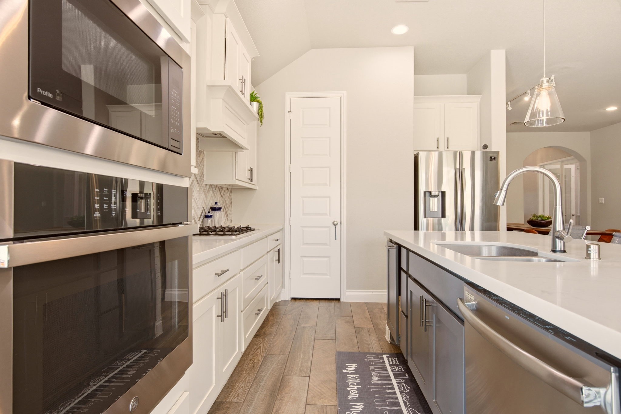 4359 Croft Creek Drive Spring, TX 77386 - Photo 16 of 46 a kitchen with stainless steel appliances a sink and a refrigerator