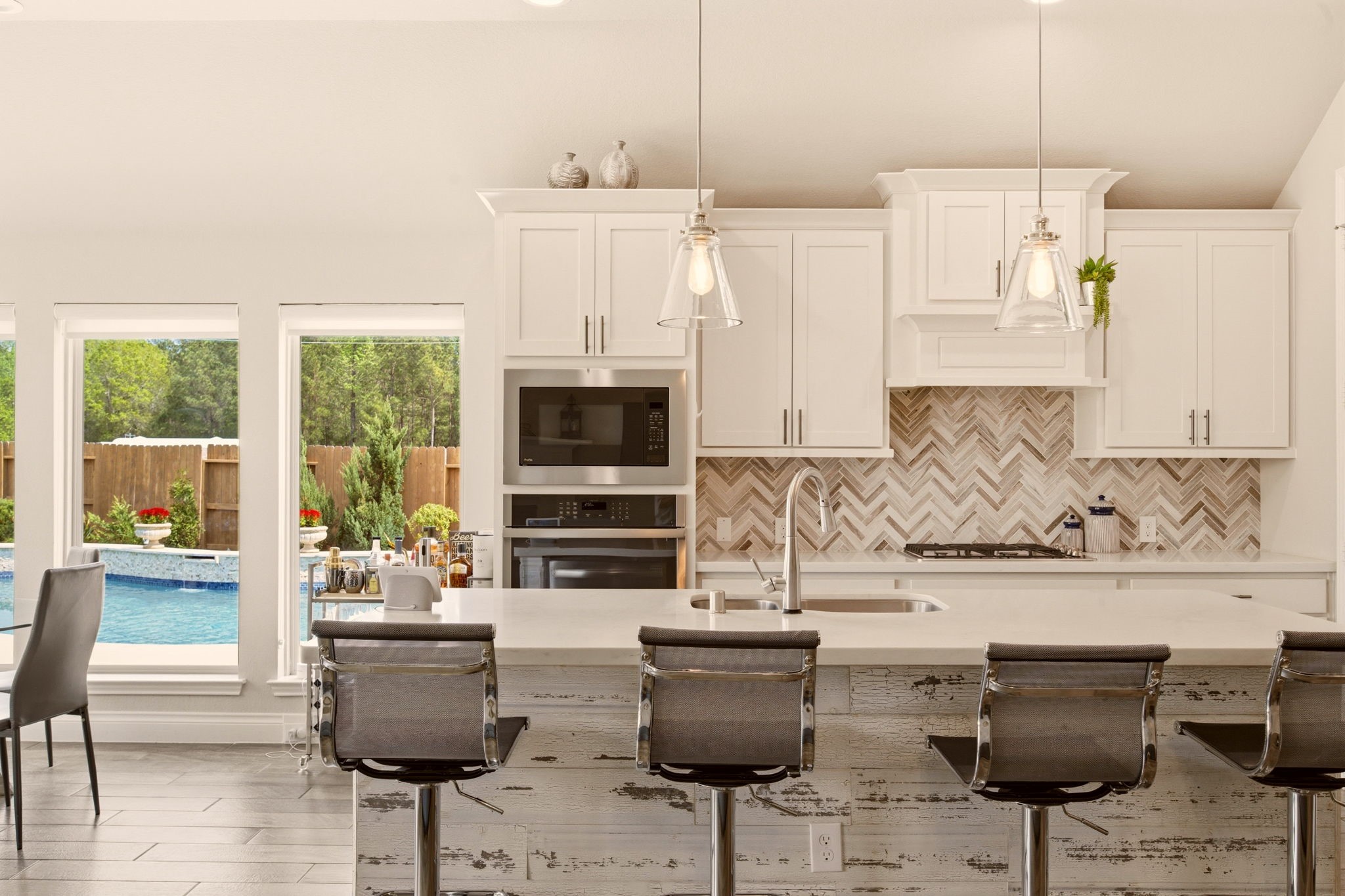 4359 Croft Creek Drive Spring, TX 77386 - Photo 17 of 46 a kitchen with stainless steel appliances kitchen island granite countertop a dining table and chairs