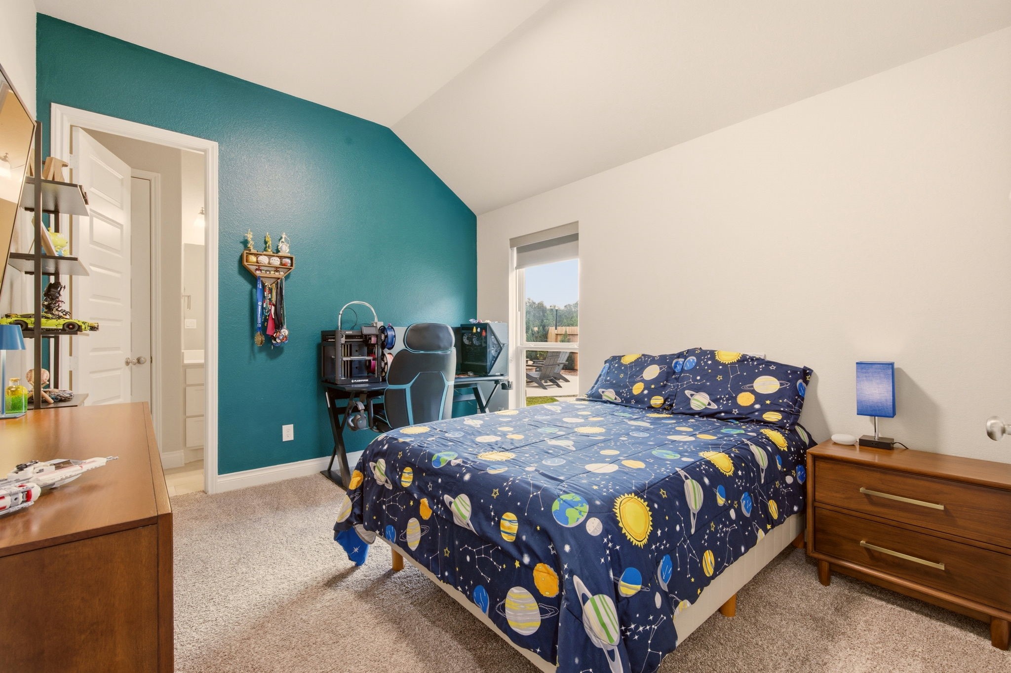 4359 Croft Creek Drive Spring, TX 77386 - Photo 23 of 46 a bedroom with a bed a dresser and book shelf