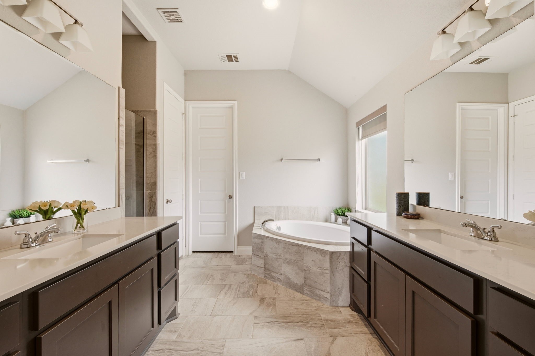 4359 Croft Creek Drive Spring, TX 77386 - Photo 28 of 46 a bathroom with a sink double vanity granite tub shower and a mirror
