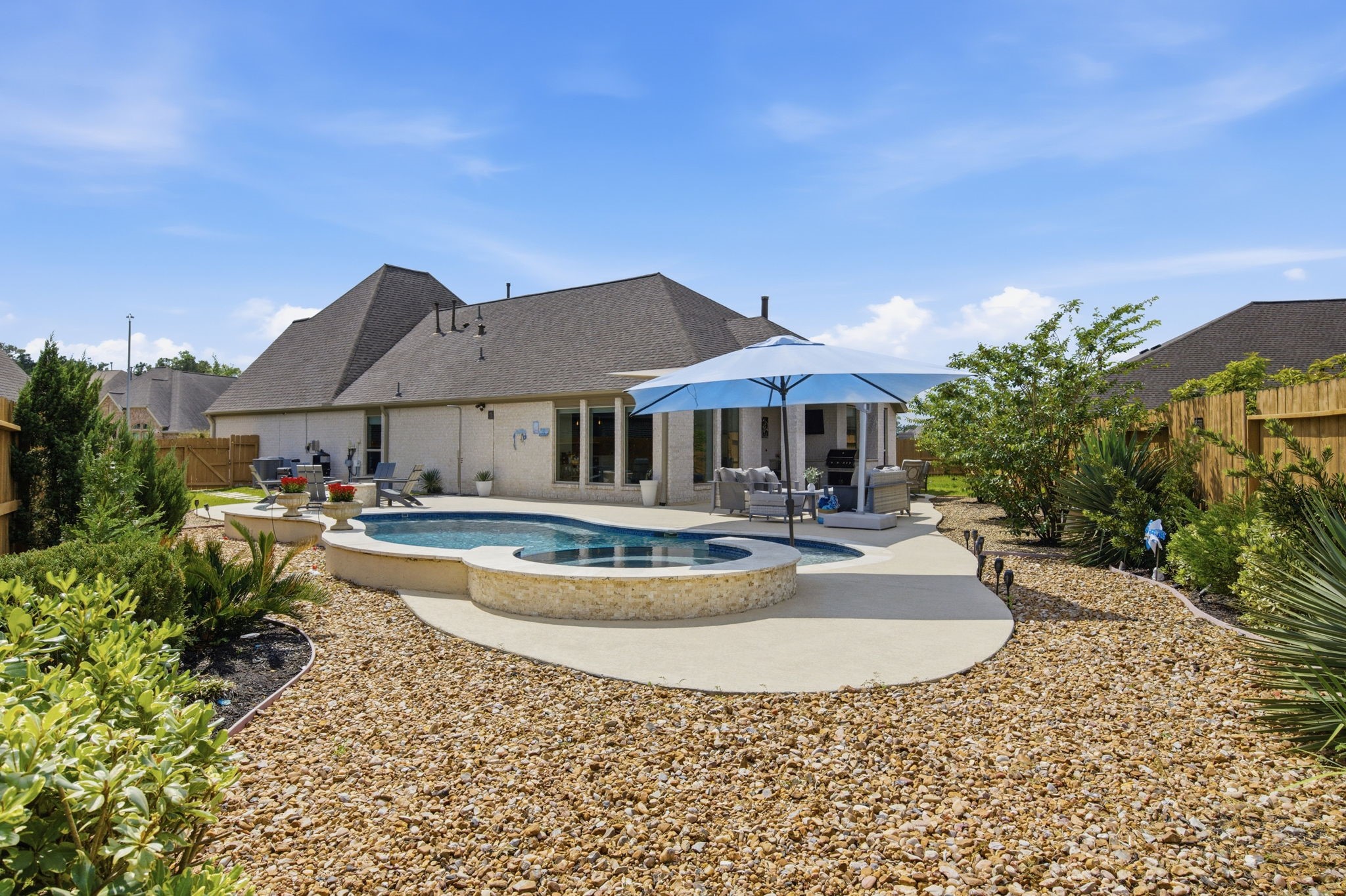 4359 Croft Creek Drive Spring, TX 77386 - Photo 32 of 46 a view of a house with swimming pool and a yard