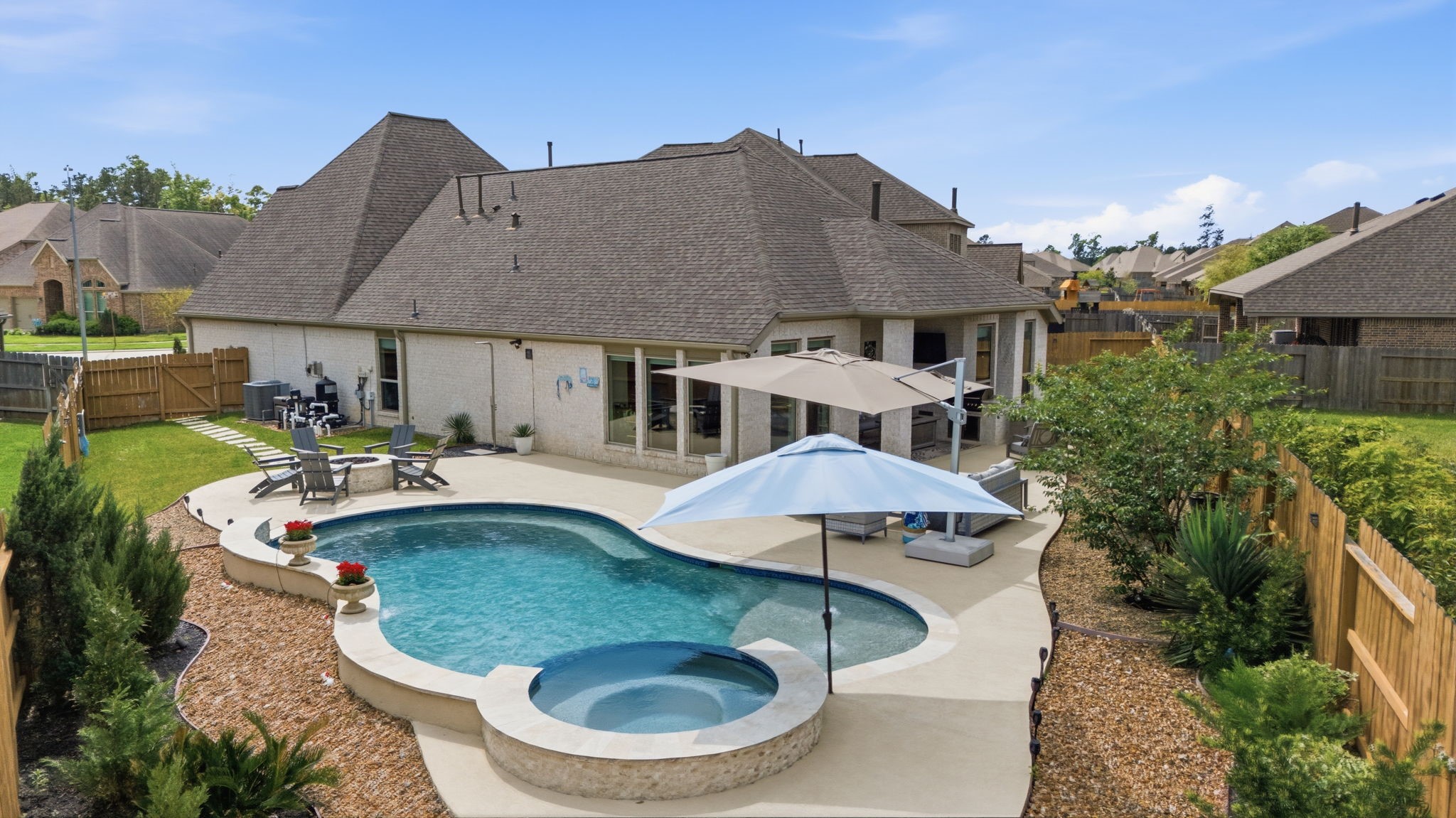 4359 Croft Creek Drive Spring, TX 77386 - Photo 33 of 46 a view of a house with swimming pool and porch