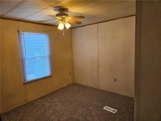 a view of a small space with a fan