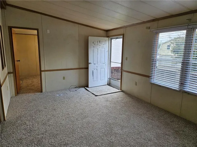 a view of empty room with windows