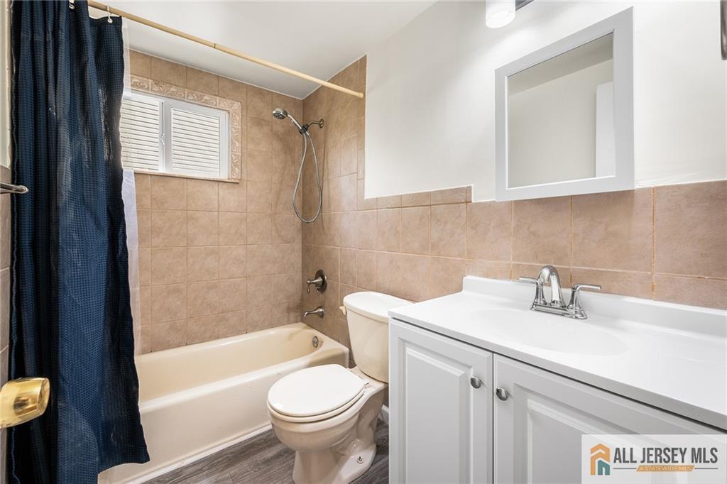 67 Drake Place Colonia, NJ 07067 - Photo 16 of 31 a bathroom with a sink toilet and shower