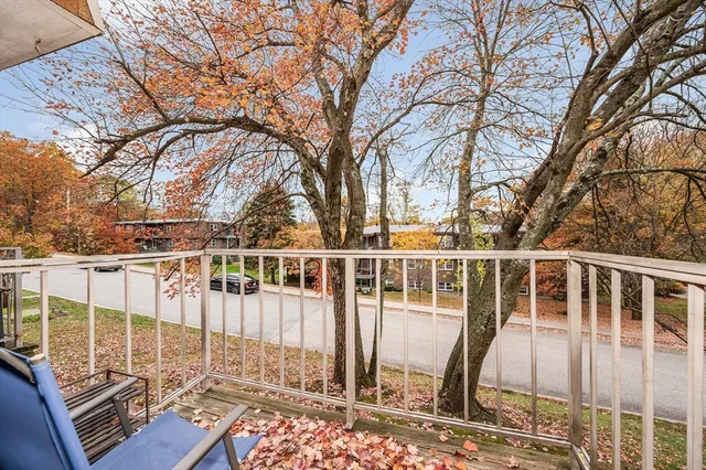 a view of a balcony with chairs