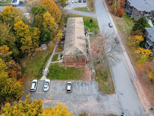 a picture of a bench in front of a wall
