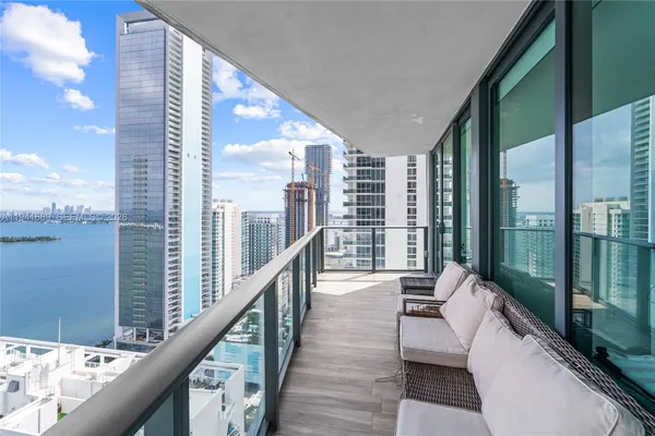 a balcony with view of outdoor space
