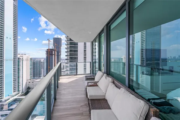 a balcony with chairs