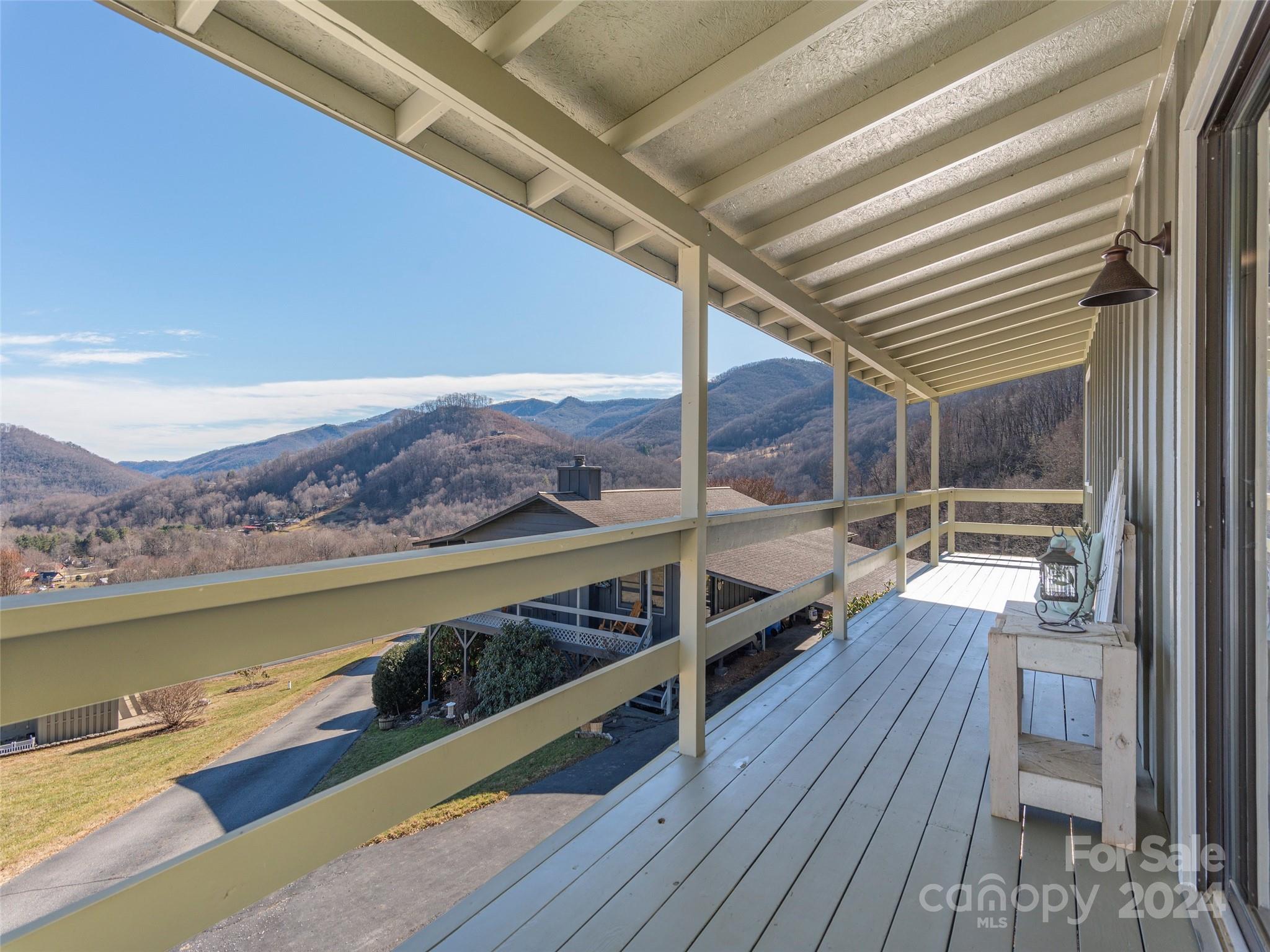 232 Stoney Ridge Loop Maggie Valley, NC 28751 - Photo 3 of 32 a view of balcony and deck with wooden floor and lake view
