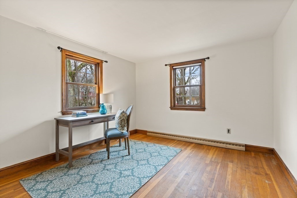 17 Sturges Road Reading, MA 01867 - Photo 21 of 29 a view of a workspace with wooden floor and a window