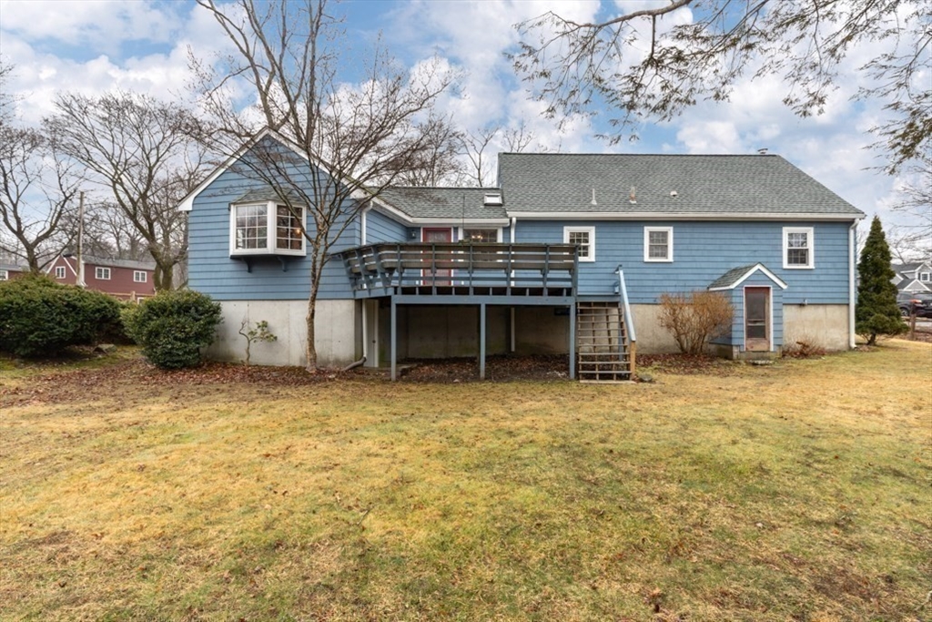 17 Sturges Road Reading, MA 01867 - Photo 26 of 29 a front view of a house with a yard and garage