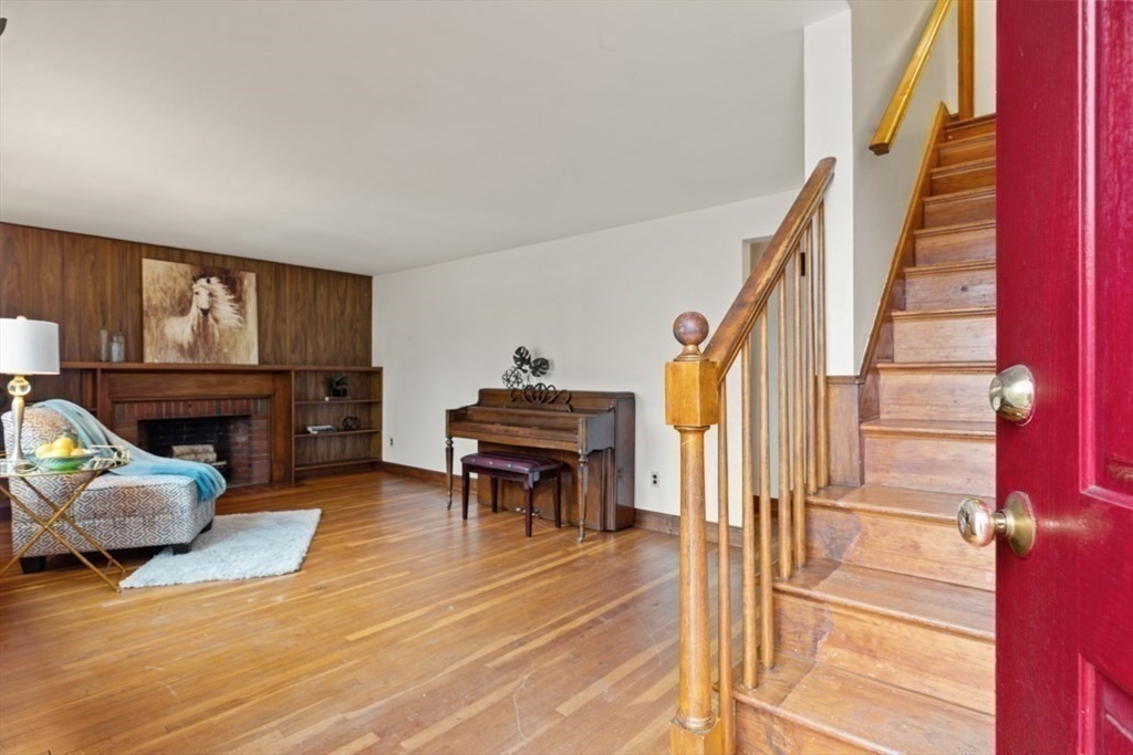 17 Sturges Road Reading, MA 01867 - Photo 5 of 29 a view of living room filled with furniture and a piano