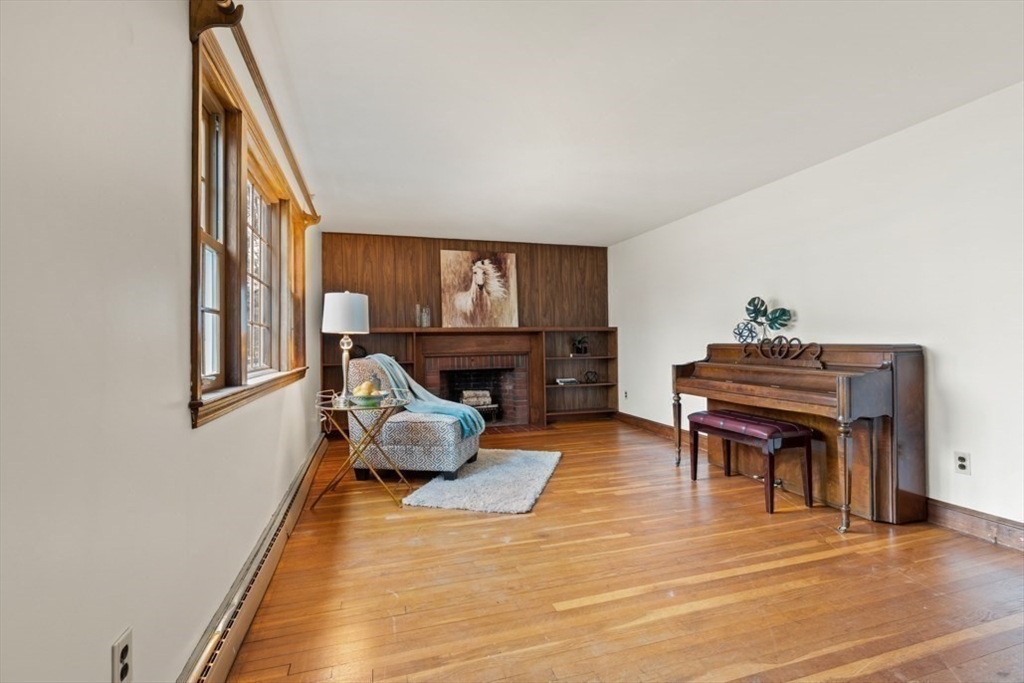 17 Sturges Road Reading, MA 01867 - Photo 6 of 29 a living room with furniture and a piano