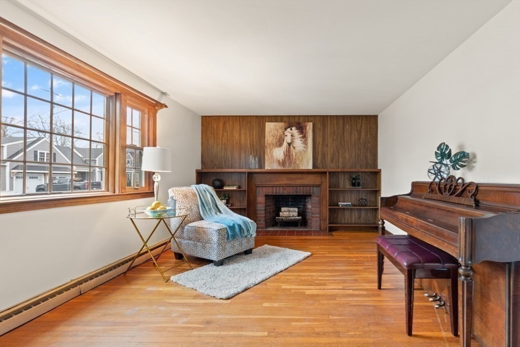 17 Sturges Road Reading, MA 01867 - Photo 8 of 29 a living room with furniture and a fireplace