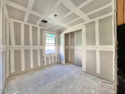 an entryway with staircase and white cabinets