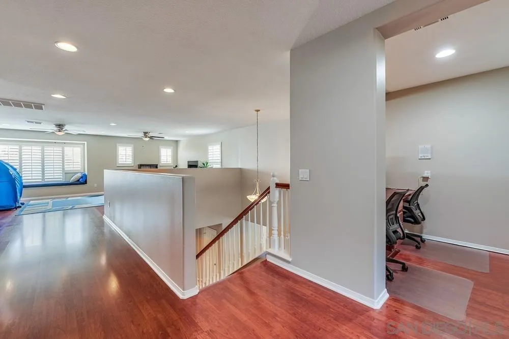 32758 Stonefield Lane Temecula, CA 92592 - Photo 12 of 30 a view of a room with wooden floor and windows