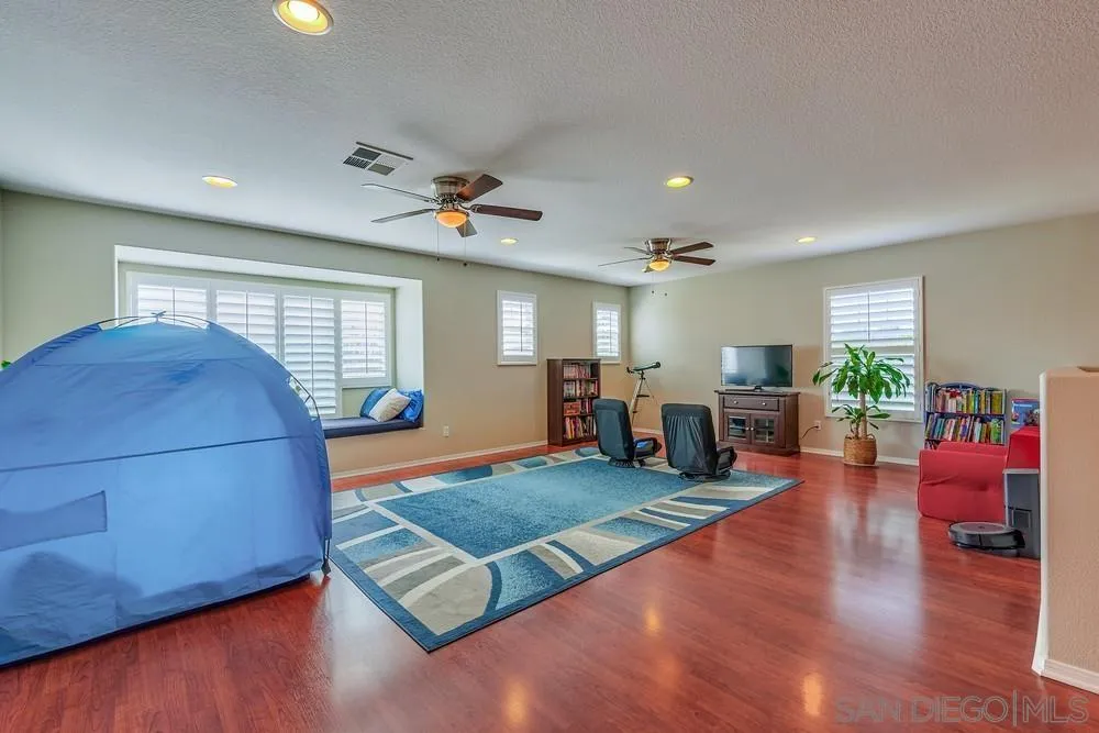 32758 Stonefield Lane Temecula, CA 92592 - Photo 13 of 30 a living room with furniture and wooden floor