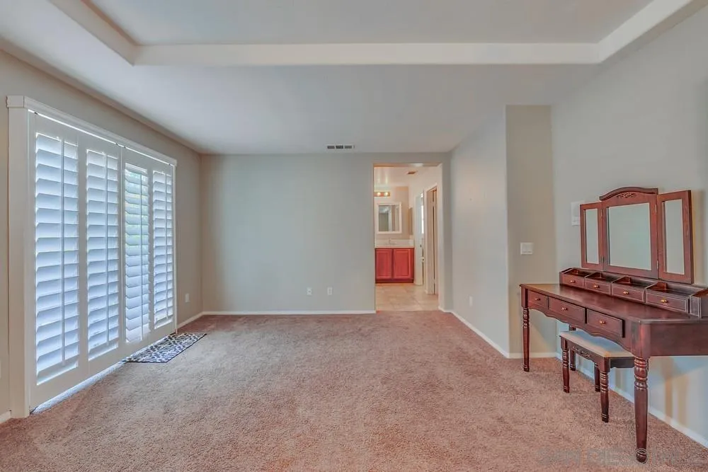 32758 Stonefield Lane Temecula, CA 92592 - Photo 15 of 30 a view of an empty room with furniture and a window
