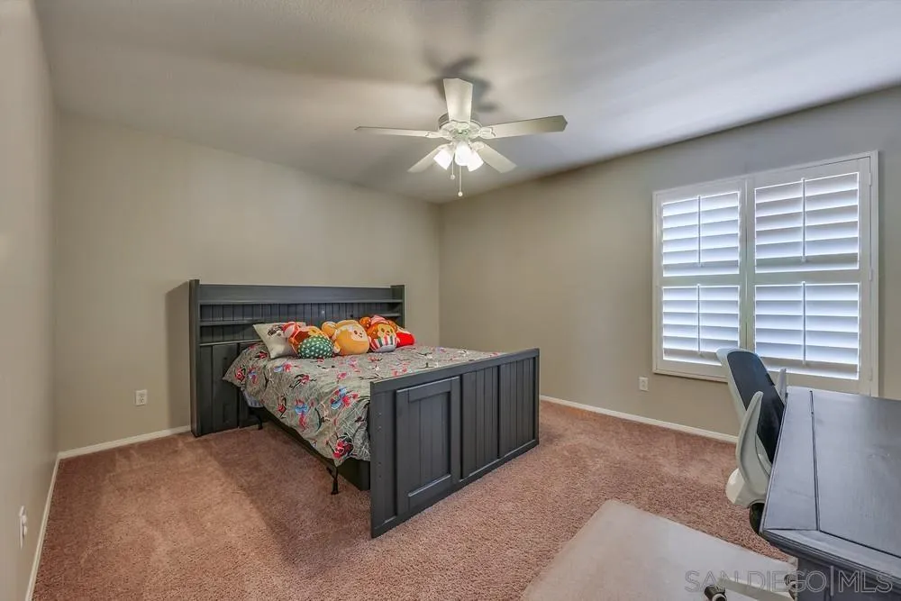 32758 Stonefield Lane Temecula, CA 92592 - Photo 22 of 30 a bed room with a bed and a window