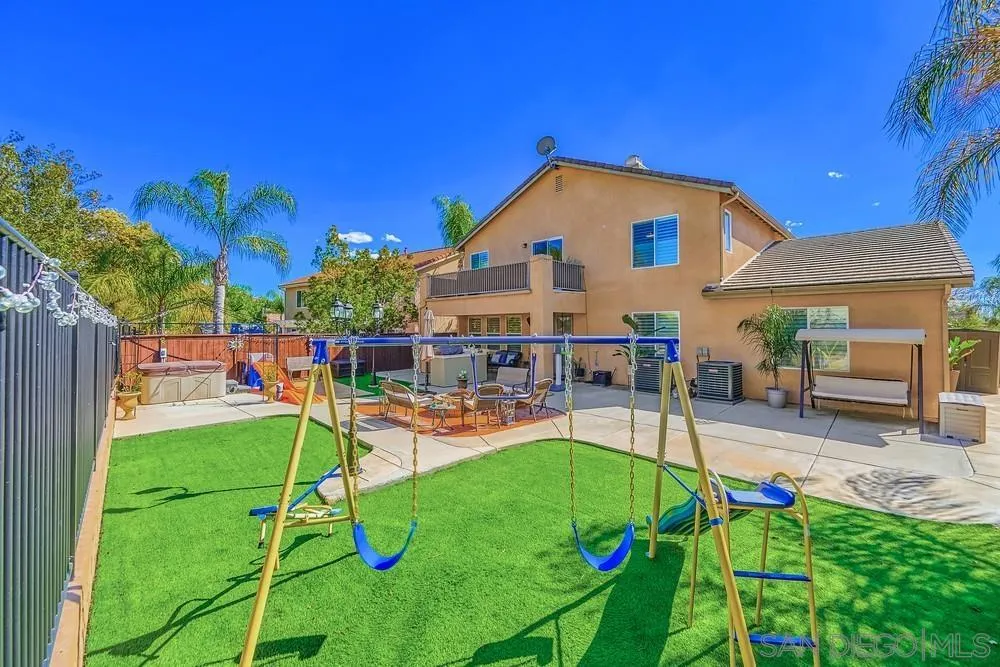 32758 Stonefield Lane Temecula, CA 92592 - Photo 29 of 30 a view of a backyard with sitting area and slide