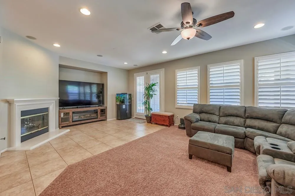 32758 Stonefield Lane Temecula, CA 92592 - Photo 6 of 30 a living room with furniture and a flat screen tv