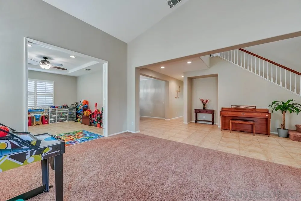 32758 Stonefield Lane Temecula, CA 92592 - Photo 8 of 30 a living room with furniture and a garage
