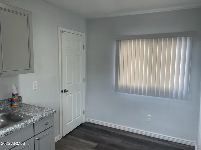 a view of a kitchen that has a sink and dishwasher in it